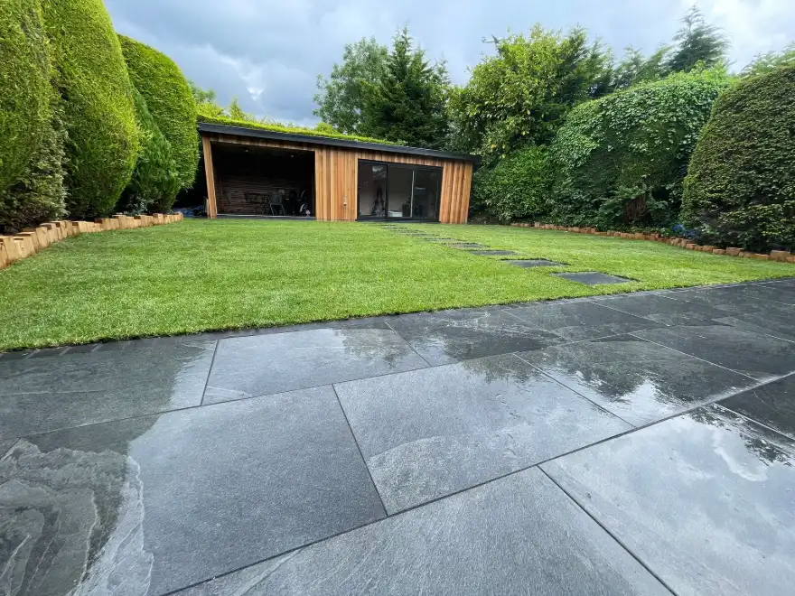 100sqm Anthracite Porcelain Patio, Granite Borders & Turf: Cheadle Transformation